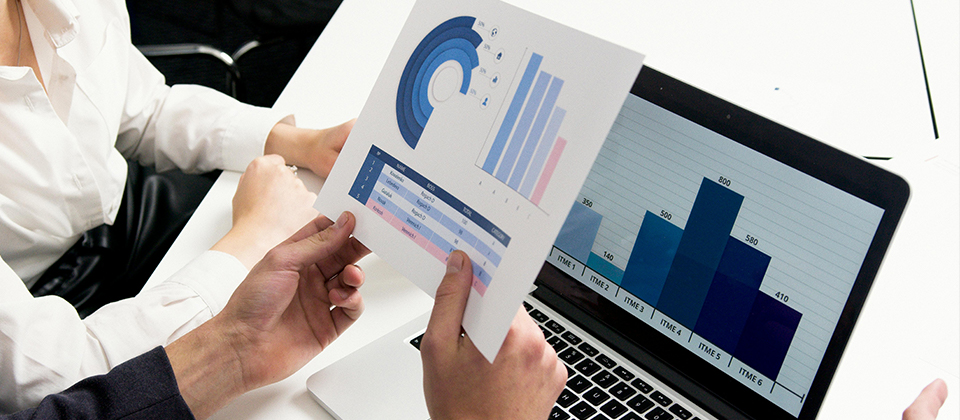 business people assess graphs, illustrating the concept of measureing incident response